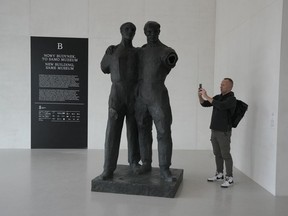 A man photographs a sculpture in the Museum of Modern Art in Warsaw, Poland, on Thursday Oct. 24, 2024.