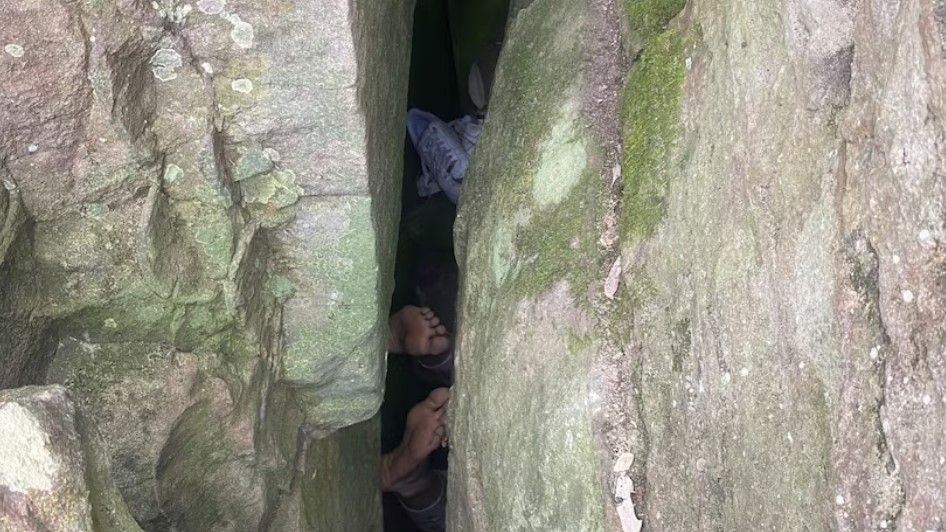 Woman Drops Phone, Gets Stuck Upside-down In Rock Crevice | Toronto Sun