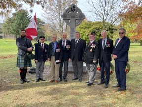 Last Post Director Brian Patterson and others attend a moving ceremony at Brampton's Meadowvale Cemetery for The Last Post Fund's Field of Honour -- Joe Warmington photo