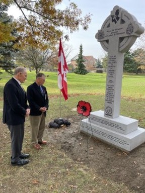 Retired officers, general Walter Natynczyk and lieutenant-colonel Mike Voith, remember deceased veterans at the Field of Honour at The Last Post’s new Cross of Sacrifice at Brampton’s Meadowvale Cemetery. (Joe Warmington photo).