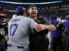 Kevin Kiermaier #93 celebrates with Shohei Ohtani #17 of the Los Angeles Dodgers after defeating the New York Yankees 7-6 in Game Five to win the 2024 World Series at Yankee Stadium on October 30, 2024 in the Bronx borough of New York City.