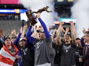 Freddie Freeman #5 of the Los Angeles Dodgers celebrates with the MVP trophy after the Dodgers defeated the New York Yankees 7-6 in game 5 to win the 2024 World Series at Yankee Stadium on October 30, 2024 in the Bronx borough of New York City.