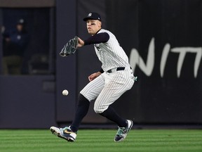 Aaron Judge #99 of the New York Yankees drops a routine fly ball hit by Tommy Edman #25 of the Los Angeles Dodgers during the fifth inning of Game Five of the 2024 World Series at Yankee Stadium on October 30, 2024 in the Bronx borough of New York City.