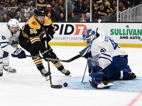 Anthony Stolarz of the Toronto Maple Leafs makes a save on a shot by Justin Brazeau of the Boston Bruins.