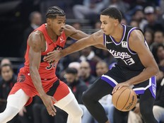 Toronto Raptors guard Ochai Agbaji guards Sacramento Kings forward Keegan Murray.