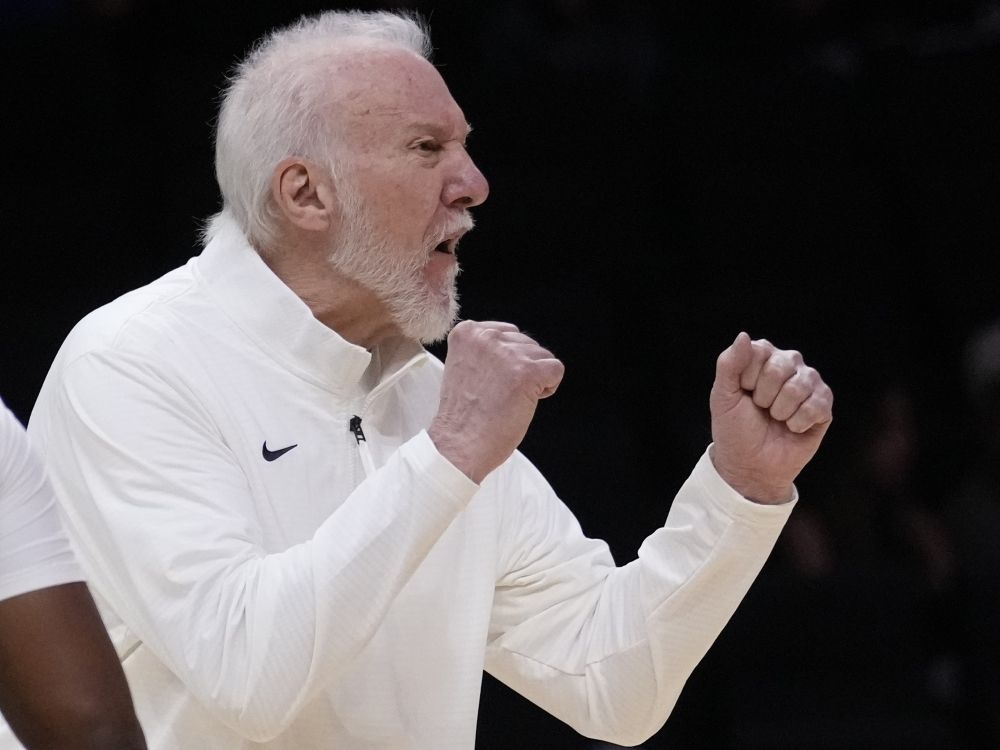 San Antonio Spurs head coach Gregg Popovich calls out to players during a game.