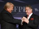 U.S. President-elect Donald Trump greets actor Sylvester Stallone onstage at the America First Policy Institute Gala held at Mar-a-Lago on Nov. 14, 2024 in Palm Beach, Fla.