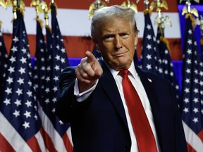 Donald Trump pointing with a smirk