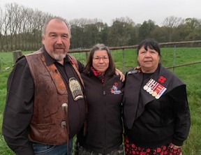 Jeff Purdy (L), a councillor with Wasoqopa'q-Acadia First Nation and great-great-grandson of Sgt. Sam Glode, Regional Chief for Nova Scotia Andrea Paul (C) and Honorary Capt. Debbie Eisan (R), an elder of the Mi’kmaw Native Friendship Centre and a Royal Canadian Navy veteran visit the area of Flanders Fields where Purdy's great-great-grandfather Sgt. Sam Glode survived a collapse during a tunnelling operation in the First World War on Thursday, Nov. 7, 2024.
