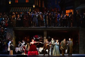 A scene from Act II of Puccini's La Bohème. MARTY SOHL/MET OPERA
