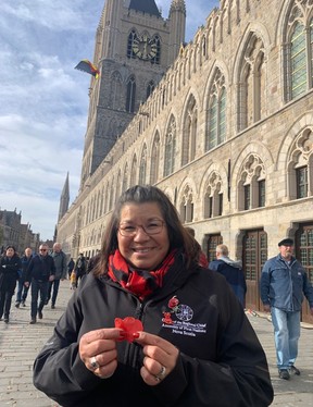 Assembly of First Nations Regional Chief Andrea Paul hold some of the paper poppy petals that were dropped from the belfry tower in Ypres, Belgium, during the city's annual Remembrance Day ceremony on Monday, Nov. 11, 2024.