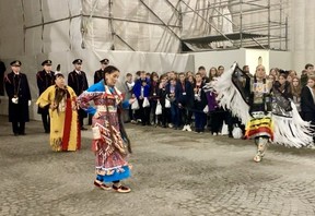 Jessie Benjamin (R), Denise John (C) and Debbie Eisan (L) perform a traditional ceremonial dance as an Indigenous delegation from Canada participated in the nightly Last Post ceremony at Menin Gate in Ypres, Belgium, on Friday, Nov. 8, 2024.