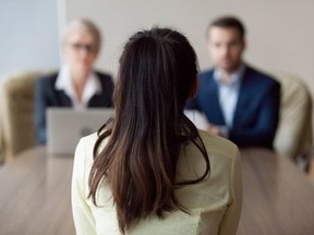 An employee meets with her employers.