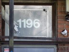 A possible bullet hole is seen above a doorway.