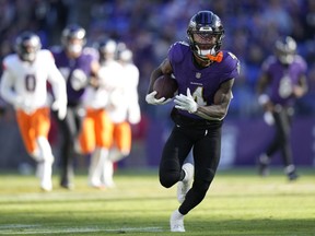NFL ROUNDUP: Jackson ends with perfect passer rating as Ravens dismantle Broncos