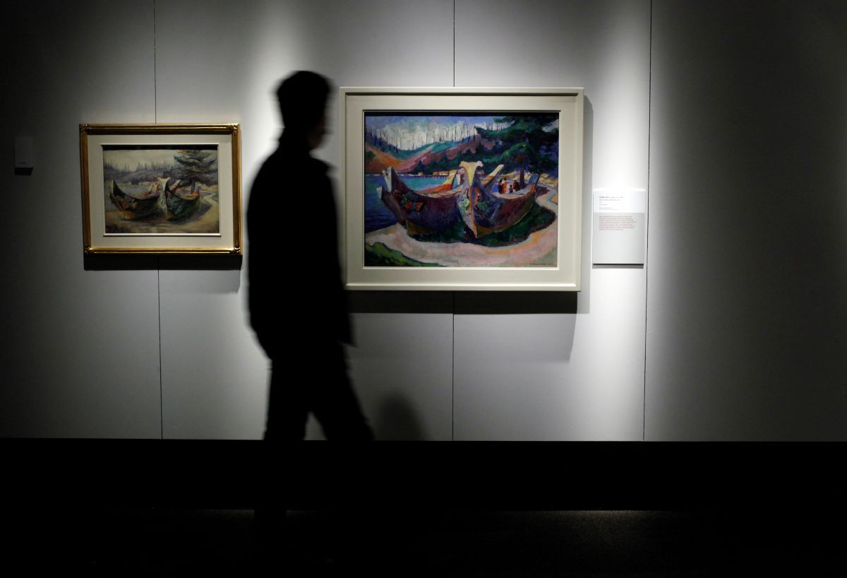 A man walks by a painting by renowned  Canadian artist Emily Carr at the Royal BC Museum in Victoria, B.C. in October 2020.