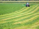 This file photo shows a farmer in his field, located about 30 kilometres west of London, Ont.