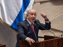 Israel's Prime Minister Benjamin Netanyahu addresses lawmakers in the Knesset, Israel's parliament, in Jerusalem. Monday Nov. 18, 2024.