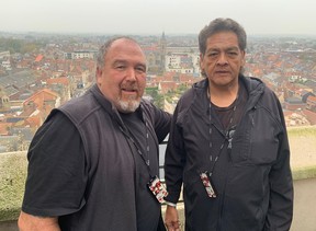 Jeff Purdy (L), the great-great-grandson of Sgt. Sam Glode, and Rick Decoteau, (R) the great-nephew of Pte. Alex Decoteau, view the many historic battlefields around Ypres, Belgium, from high atop the city's bellfry on Wednesday, Nov. 6, 2024.