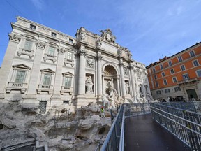 A person is seen working at the renovation of the Trevi Fountain on Nov. 9, 2024.