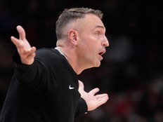 Toronto Raptors head coach Darko Rajakovic reacts to a call from a referee during a game against the New York Knicks.