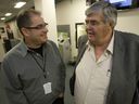 Toronto Sun columnist Steve Simmons (left) chats with former Edmonton Sun columnist Terry Jones in the press box at a Maple Leafs game in 2011.