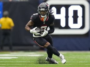 Houston Texans wide receiver John Metchie III runs the ball against the Miami Dolphins.