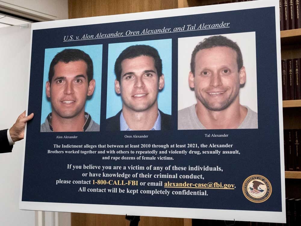  A display showing images of Alon, Oren, and Tal Alexander prior to a news conference with Manhattan U.S. Attorney Damian Williams in New York, on Dec. 11, 2024.
