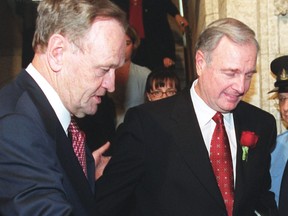 Prime minister Jean Chretien gestures to finance minister Paul Martin.