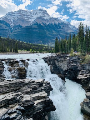 Athabasca Falls in Jasper National Park is one of the most powerful falls to be found in the mountain national parks. Pouring over a layer of hard quartzite, the falls have cut into the softer limestone beneath, carving intricate features, including potholes and a short canyon.