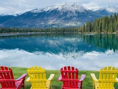 Lac Beauvert reflects Pyramid Mountain on a brilliant morning at Fairmont Jasper Park Lodge.