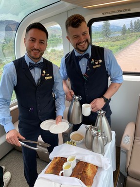 Rocky Mountaineer attendants Jacques Van Niekirk from South Africa and Mauro Cavada from Chile serving in the Gold Leaf dome car.