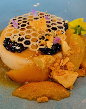 ARC Reastaurant at Fairmont waterfront in Vancouver incorporates honey from its outdoor garden into crème caramel with honey roasted peaches, blackberries and honeycomb.