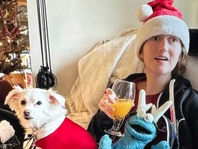 Caroline at home in Christmas mode with her dog, Rosie, and Cookie Monster. (Supplied photo)
