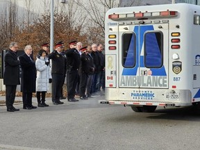 Officials pay their respects to the late Toronto Police Det. John Park.