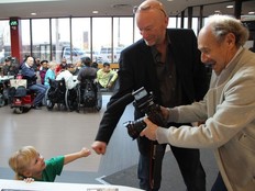 Mike Strobel and former Sun photographer Stan Behal with wee Madison Ambos at Variety Village during a past campaign. (ERIN RIVET/Variety)