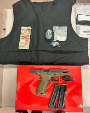 A bulletproof vest and firearm seized in an investigation. TORONTO POLICE HANDOUT