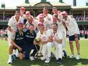 Pat Cummins of Australia celebrates with teammates in front of the Members Pavilion after reclaiming the Border–Gavaskar Trophy against India.