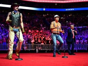 U.S. president-elect Donald Trump dances as the Village People perform.