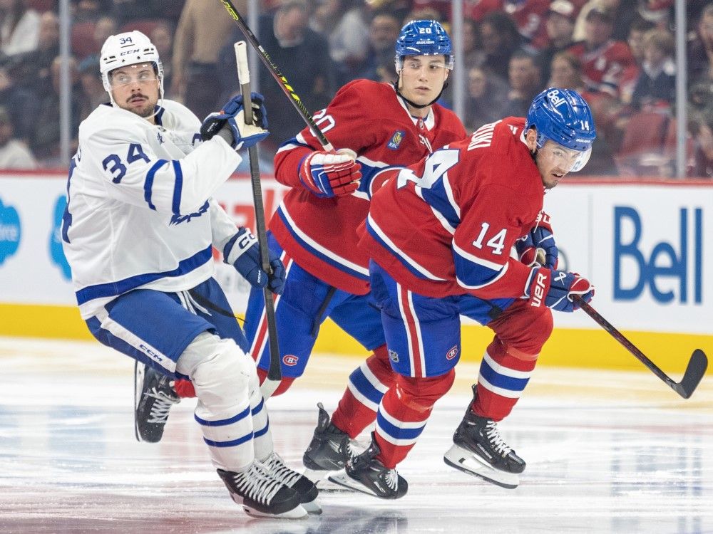 Canadiens forwards Juraj Slafkovsky (centre) and Nick Suzuki (right) skate near Maple Leafs forward Austin Matthews during third period NHL action in Montreal, Oct. 9, 2024.