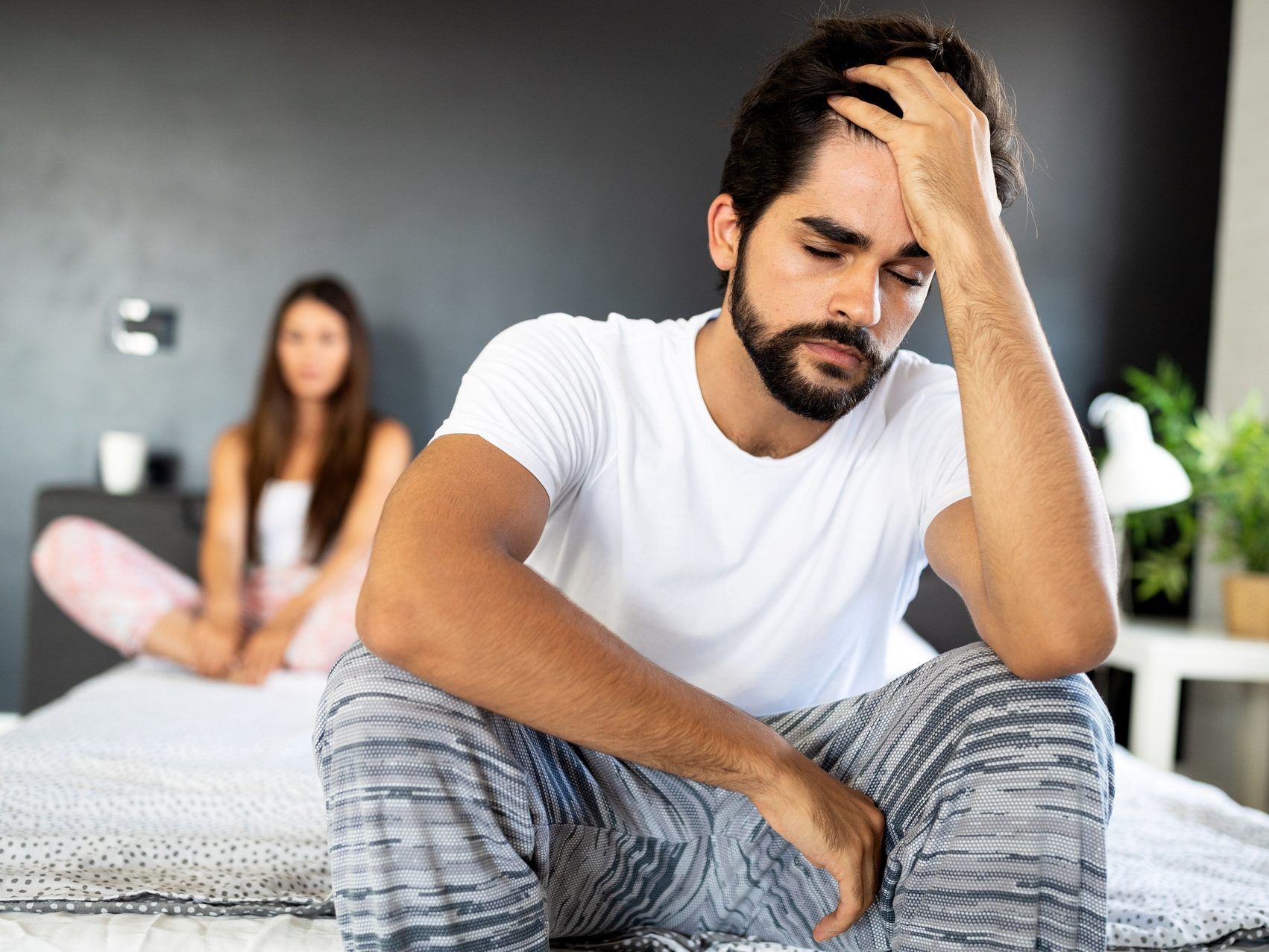 Unhappy couple having problems in the bedroom.