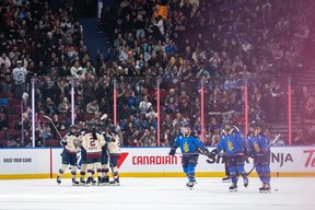 Montreal Victoire's Marie-Philip Poulin, left, celebrates her goal with teammates as the Toronto Sceptres skate back to the bench during second period PWHL hockey action in Vancouver, on Wednesday, January 8, 2025. THE CANADIAN PRESS/Ethan Cairns