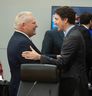 Prime Minister Justin Trudeau greets Ontario Premier Doug Ford at the Diefenbaker building in Ottawa ahead of the first minister's meeting on Wednesday, Jan. 15 2025.
