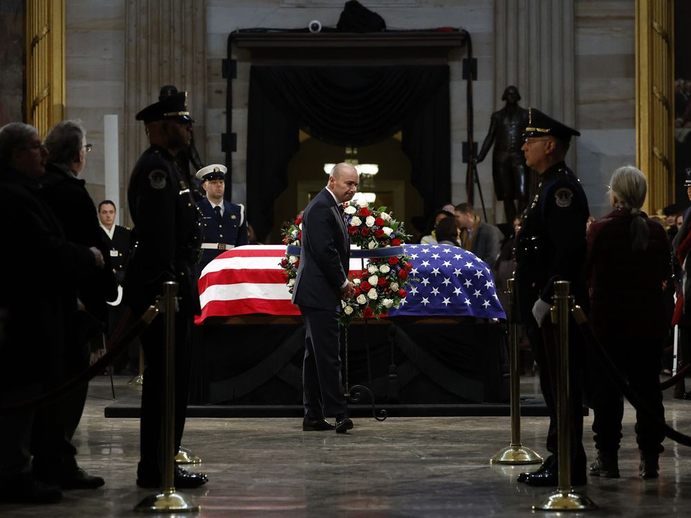 Admirers of Jimmy Carter travel to view his casket lying in state at Capitol