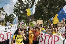 People march during a mass demonstration against overtourism, which affects the local population with inaccessible housing, among other things, in Santa Cruz de Tenerife, Spain, April 20, 2024. (AP Photo/Miguel Velasco Almendral)