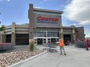 A cart vendor assembles shopping carts outside a Costco warehouse in Sheridan, Colorado, on July 16, 2024.