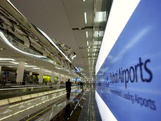 A man walks towards the departure lounge at Dubai International Airport's Terminal 3