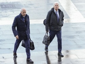 Amanda Knox lawyers Luca Luparia Donati, left, and Carlo Dalla Vedova arrive at the first section of the Supreme Court in Rome, in Rome, Thursday, Jan. 23, 2025.