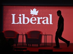 A stagehand works on the stage in between presenters at the 2023 Liberal National Convention in Ottawa, on Thursday, May 4, 2023.