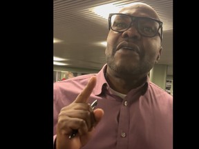 Chris Moise speaks to constituent Daniel Tate